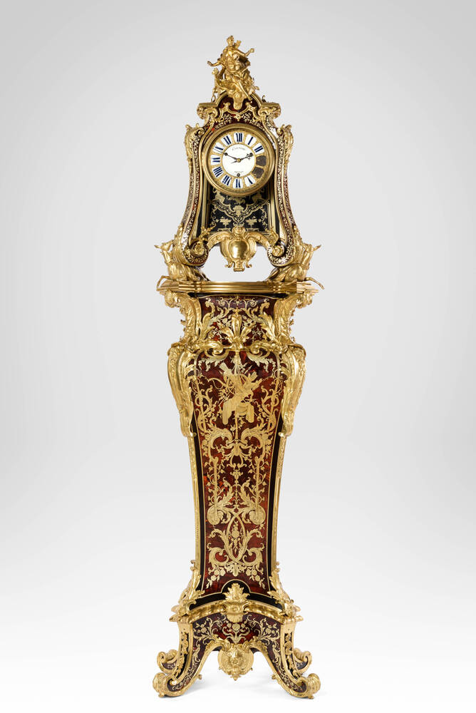 two pendulum clocks resting on back of deers (pendule aux biches)